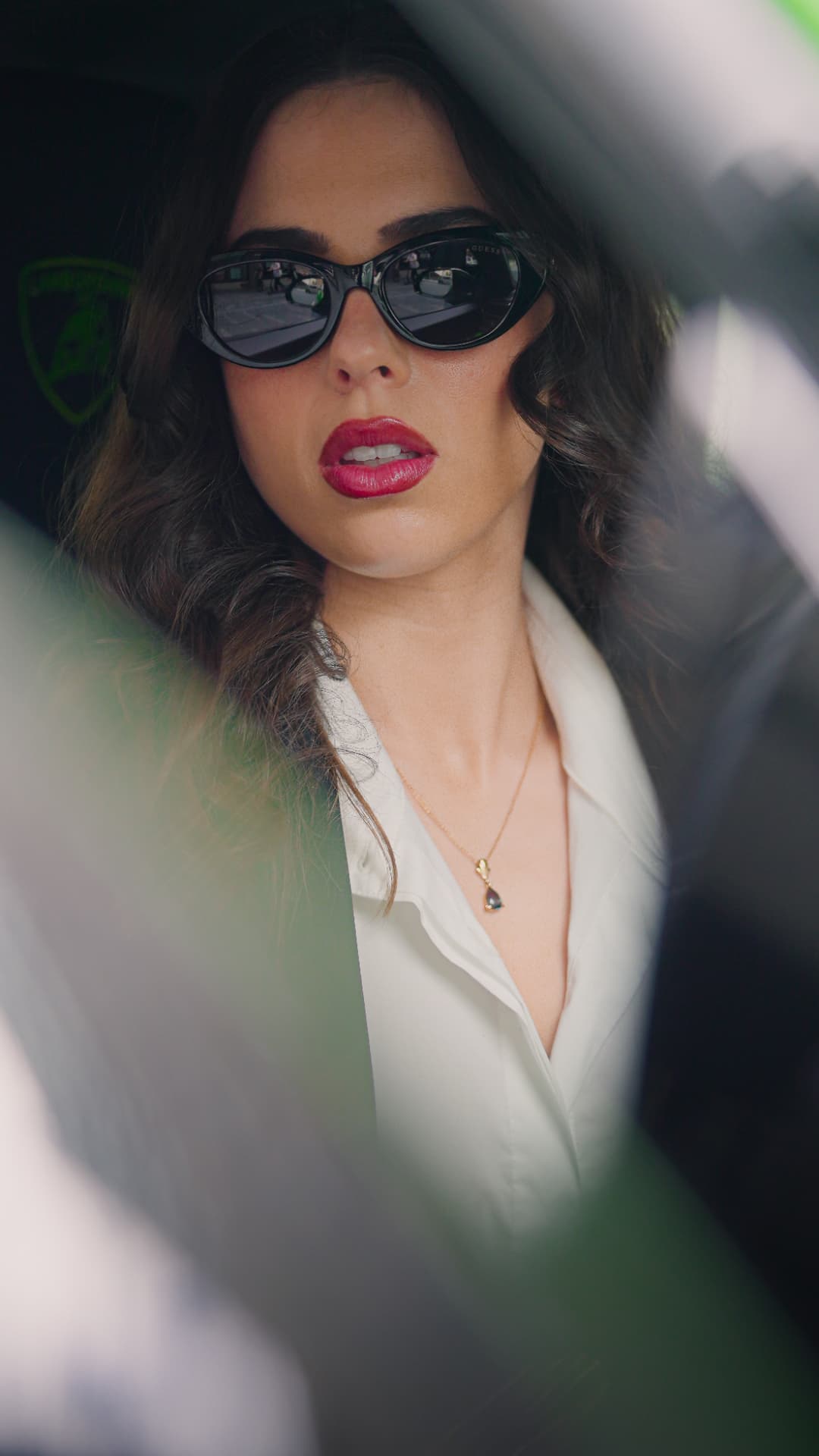 Portrait framed through the window of a car
