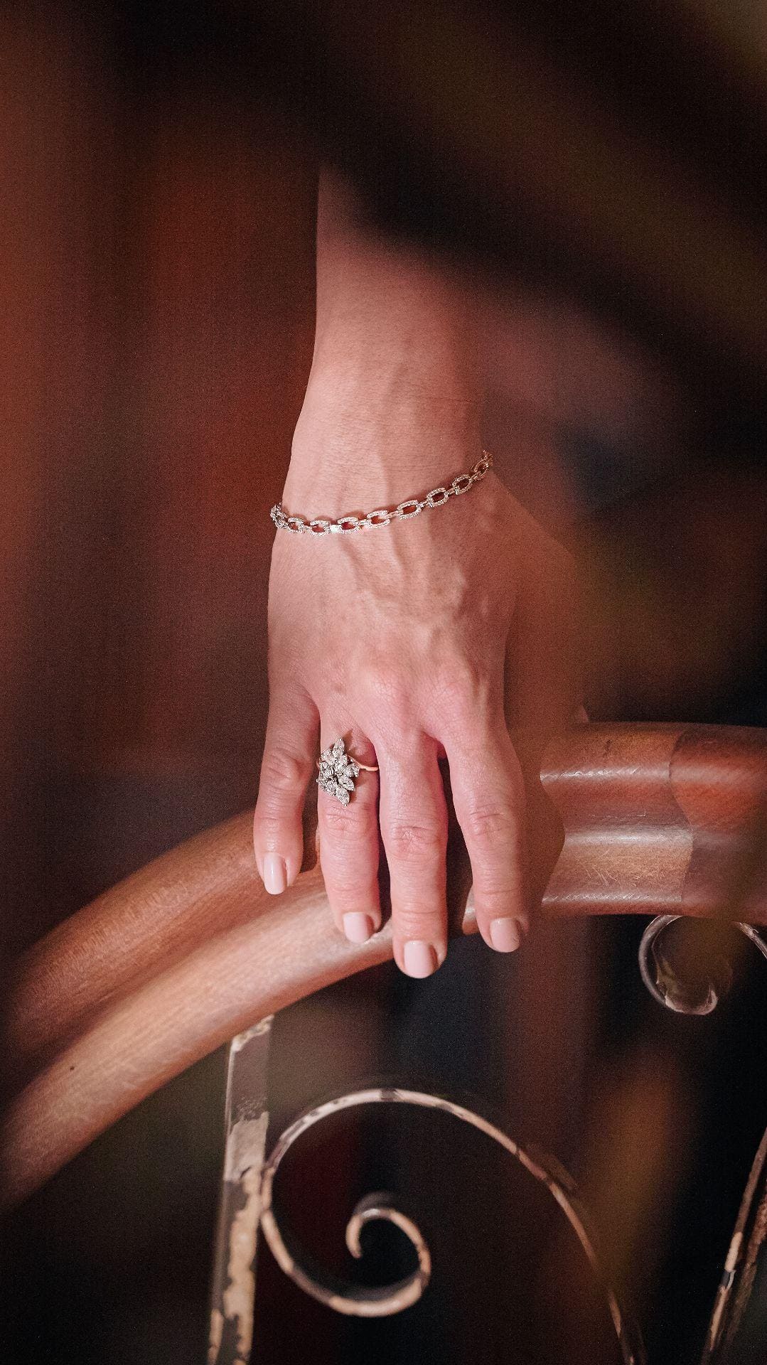 Jewellery detail against a dark dress